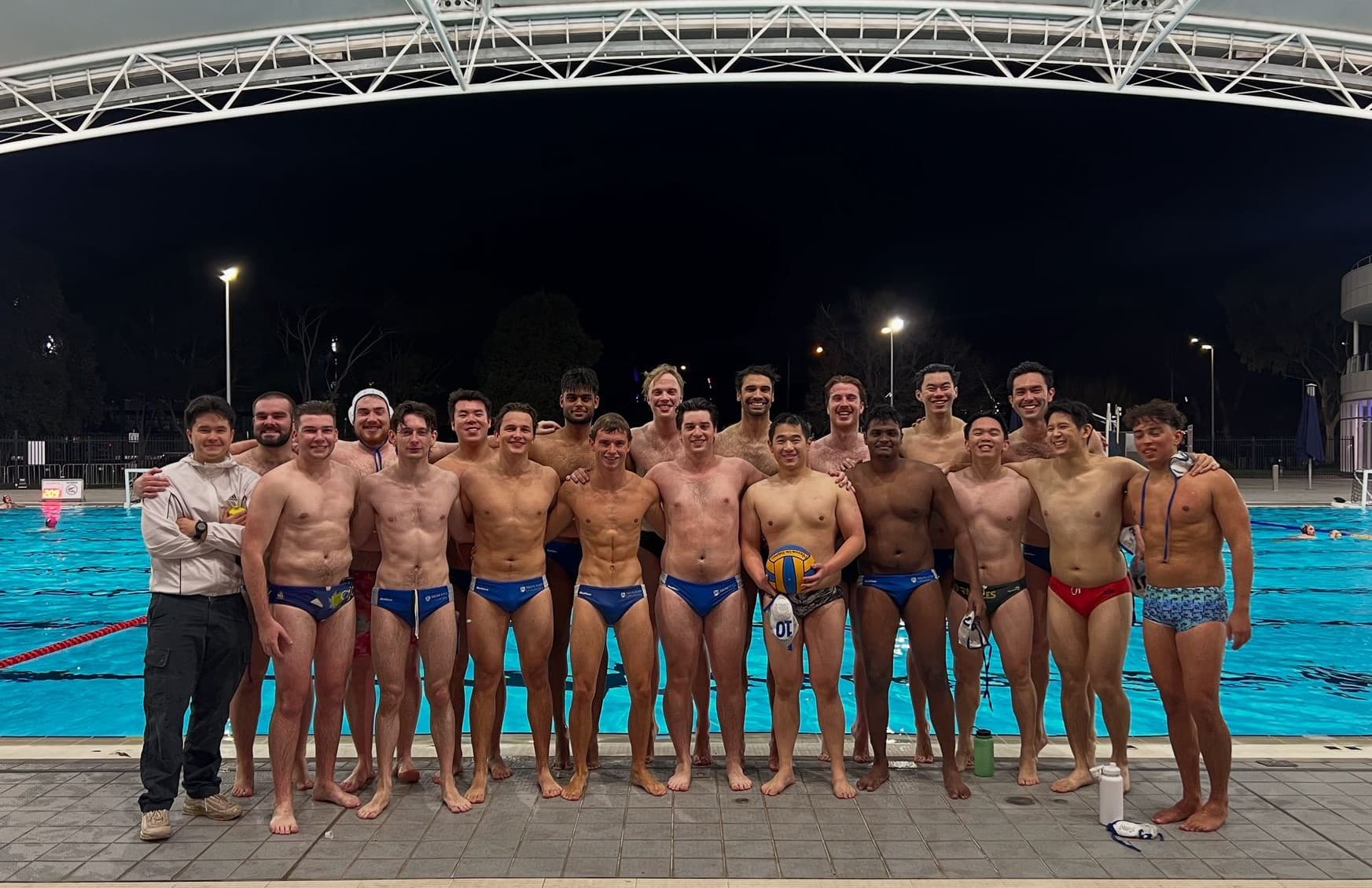 Monash University water polo team on pool deck